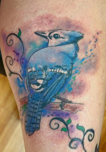 Blue Jay bird tattoo, as shown in carousel slideshow